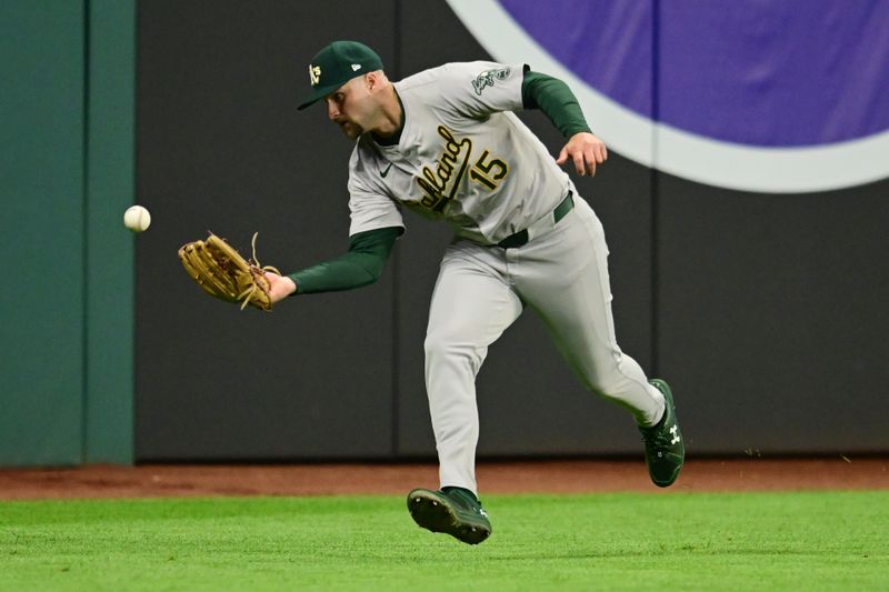 Apr 19, 2024; Cleveland, Ohio, USA; Oakland Athletics left fielder Seth Brown (15) can not catch a ball hit by Cleveland Guardians catcher Bo Naylor (not pictured) during the eighth inning at Progressive Field. Mandatory Credit: Ken Blaze-USA TODAY Sports