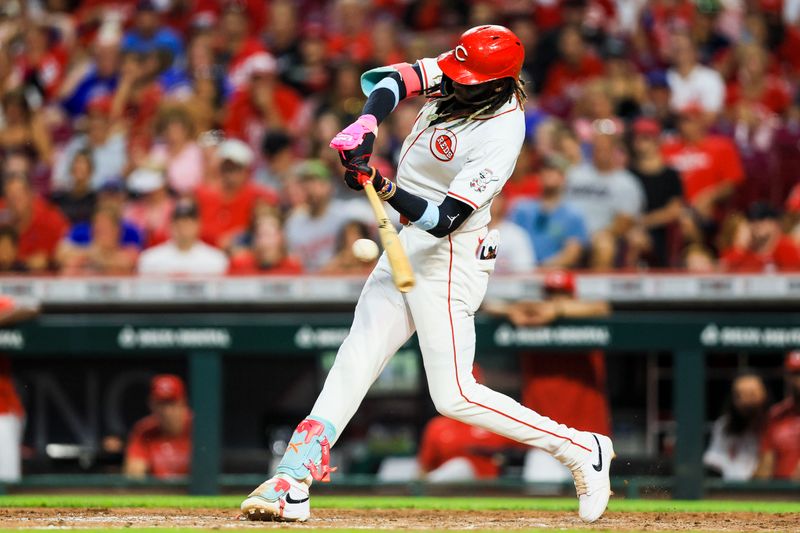 Jul 30, 2024; Cincinnati, Ohio, USA; Cincinnati Reds shortstop Elly De La Cruz (44) hits a single in the sixth inning against the Chicago Cubs at Great American Ball Park. Mandatory Credit: Katie Stratman-USA TODAY Sports