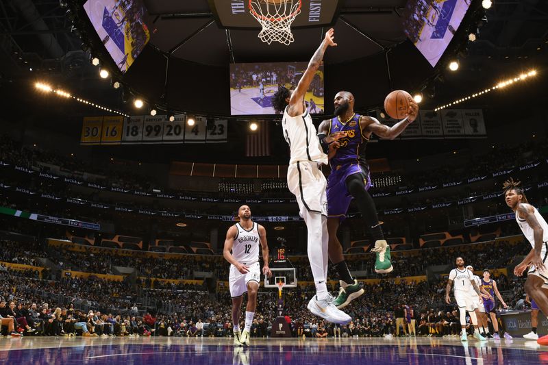 LOS ANGELES, CA - JANUARY 17:LeBron James #23 of the Los Angeles Lakers passes the ball during the game against the Los Angeles Lakers on January 17, 2025 at Crypto.Com Arena in Los Angeles, California. NOTE TO USER: User expressly acknowledges and agrees that, by downloading and/or using this Photograph, user is consenting to the terms and conditions of the Getty Images License Agreement. Mandatory Copyright Notice: Copyright 2025 NBAE (Photo by Adam Pantozzi/NBAE via Getty Images)