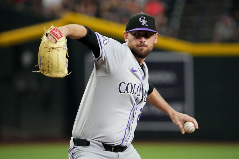 Aug 13, 2024; Phoenix, Arizona, USA; Colorado Rockies pitcher Austin Gomber (26) pitches against the Arizona Diamondbacks during the first inning at Chase Field. Mandatory Credit: Joe Camporeale-USA TODAY Sports