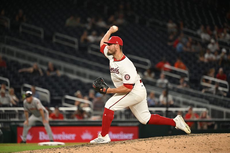 Aug 6, 2024; Washington, District of Columbia, USA; Washington Nationals relief pitcher Tanner Rainey (21) throws pitch against the San Francisco Giants during the ninth inning at Nationals Park. Mandatory Credit: Rafael Suanes-USA TODAY Sports