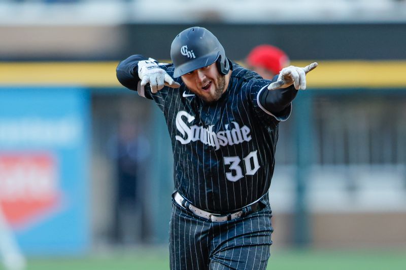 Apr 18, 2023; Chicago, Illinois, USA; Chicago White Sox first baseman Jake Burger (30) rounds the bases after hitting a three-run home run against the Philadelphia Phillies during the first inning of game two of the doubleheader at Guaranteed Rate Field. Mandatory Credit: Kamil Krzaczynski-USA TODAY Sports