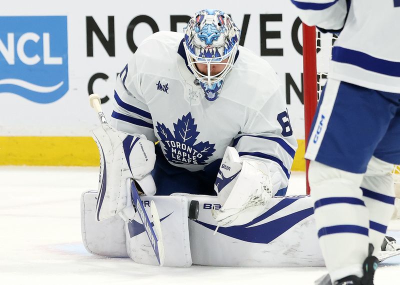 May 11, 2025; Sunrise, Florida, USA; Toronto Maple Leafs goaltender Joseph Woll (60) makes a save against the Florida Panthers during the second period in game four of the second round of the 2025 Stanley Cup Playoffs at Amerant Bank Arena. Mandatory Credit: Kim Klement Neitzel-Imagn Images