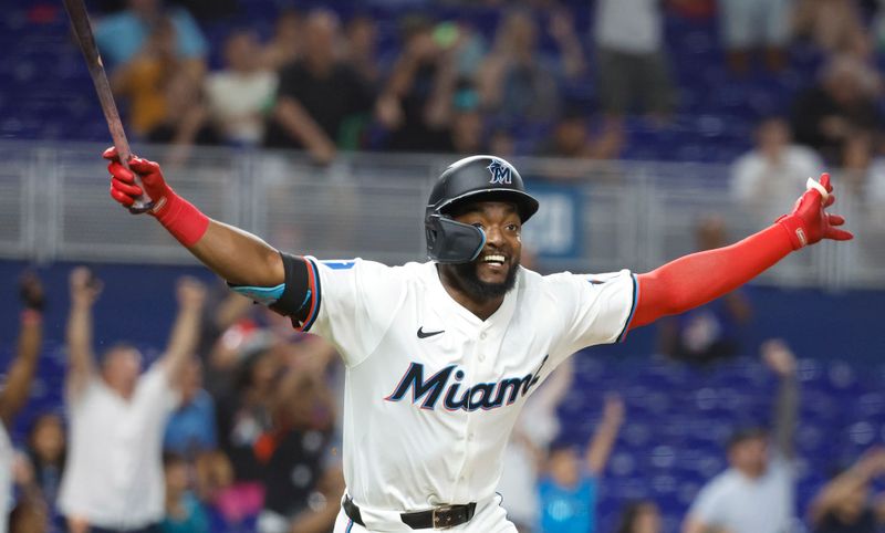 Jun 18, 2024; Miami, Florida, USA;  Miami Marlins shortstop Vidal Brujan (17) gets doused reacts after singling in the winning run against the St. Louis Cardinals  after the tenth inning at loanDepot Park. Mandatory Credit: Rhona Wise-USA TODAY Sports