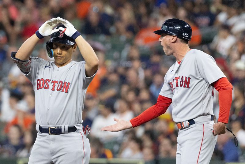 Aug 21, 2023; Houston, Texas, USA; Boston Red Sox first base coach/outfield instructor Kyle Hudson (84) celebrates  left fielder Masataka Yoshida (7) single against the Houston Astros  in the first inning at Minute Maid Park. Mandatory Credit: Thomas Shea-USA TODAY Sports