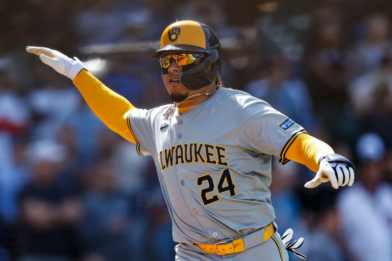 May 3, 2024; Chicago, Illinois, USA; Milwaukee Brewers catcher William Contreras (24) celebrates after scoring against the Chicago Cubs during the eight inning at Wrigley Field. Mandatory Credit: Kamil Krzaczynski-USA TODAY Sports