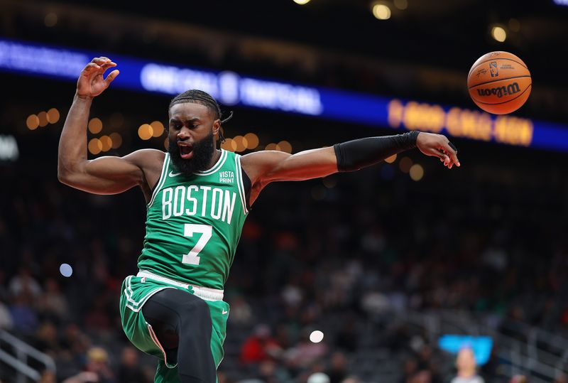 ATLANTA, GEORGIA - MARCH 28:  Jaylen Brown #7 of the Boston Celtics dunks against the Atlanta Hawks during the first quarter at State Farm Arena on March 28, 2024 in Atlanta, Georgia.  NOTE TO USER: User expressly acknowledges and agrees that, by downloading and/or using this photograph, user is consenting to the terms and conditions of the Getty Images License Agreement.  (Photo by Kevin C. Cox/Getty Images)