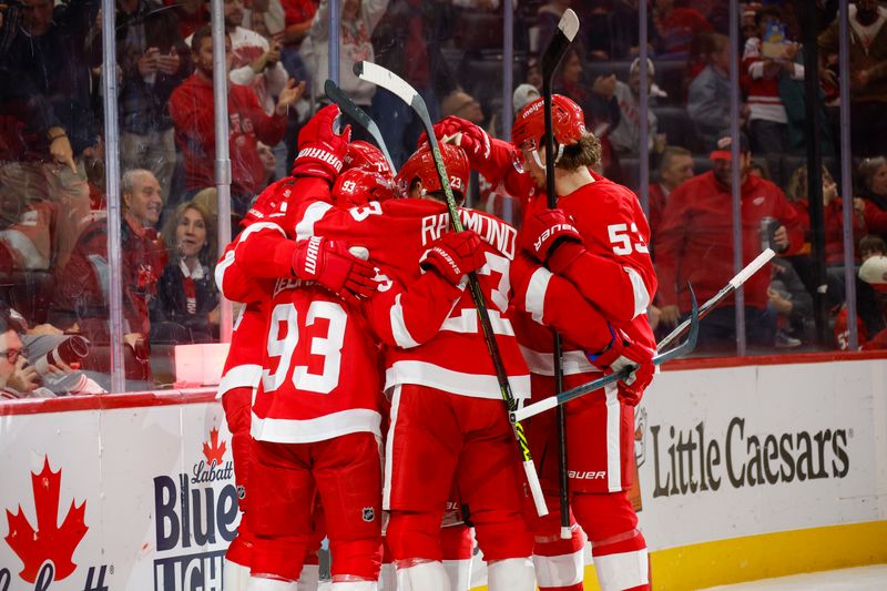 Nov 2, 2024; Detroit, Michigan, USA; The Detroit Red Wings celebrate a goal by center Dylan Larkin (71) during the second period against Buffalo Sabres at Little Caesars Arena. Mandatory Credit: Brian Bradshaw Sevald-Imagn Images