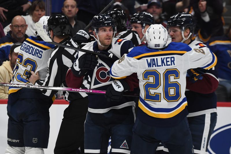 Jan 31, 2025; Denver, Colorado, USA; Colorado Avalanche defenseman Devon Toews (7) St. Louis Blues left wing Nathan Walker (26) and other players have to be separated after the whistle during the first period at Ball Arena. Mandatory Credit: Christopher Hanewinckel-Imagn Images