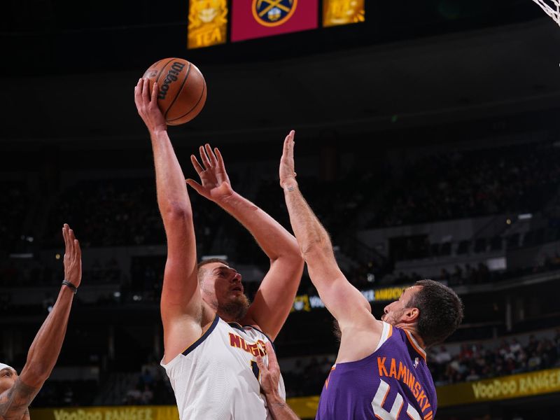 DENVER, CO - OCTOBER 13: Nikola Jokic #15 of the Denver Nuggets drives to the basket during the game against the Phoenix Suns on October 13, 2024 at Ball Arena in Denver, Colorado. NOTE TO USER: User expressly acknowledges and agrees that, by downloading and/or using this Photograph, user is consenting to the terms and conditions of the Getty Images License Agreement. Mandatory Copyright Notice: Copyright 2024 NBAE (Photo by Bart Young/NBAE via Getty Images)