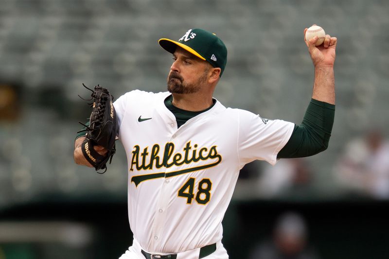 Apr 13, 2024; Oakland, California, USA; Oakland Athletics pitcher T.J. McFarland (48) delivers a pitch against the Washington Nationals during the ninth inning at Oakland-Alameda County Coliseum. Mandatory Credit: D. Ross Cameron-USA TODAY Sports