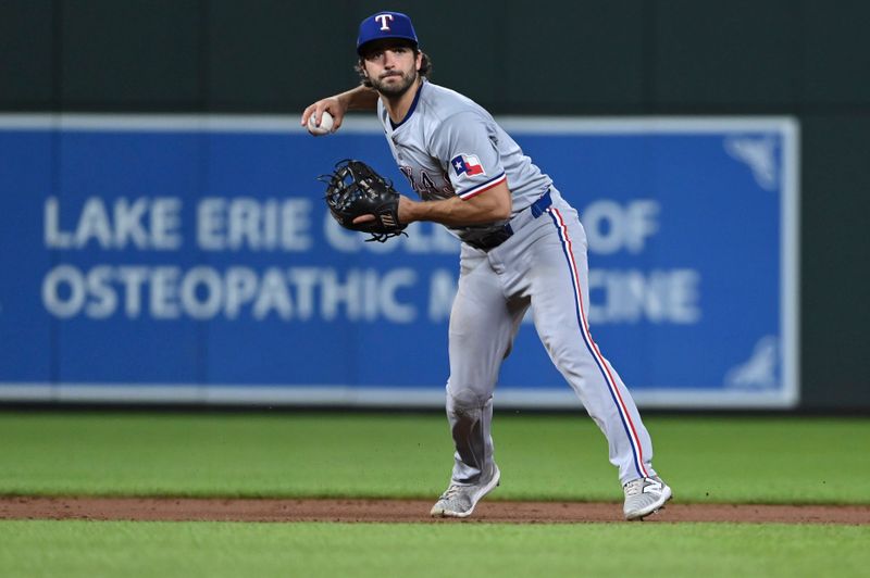 Jun 29, 2024; Baltimore, Maryland, USA;  Texas Rangers third baseman Josh Smith (8) throws to first base during the eighth inning 
against the Baltimore Orioles at Oriole Park at Camden Yards. Mandatory Credit: Tommy Gilligan-USA TODAY Sports