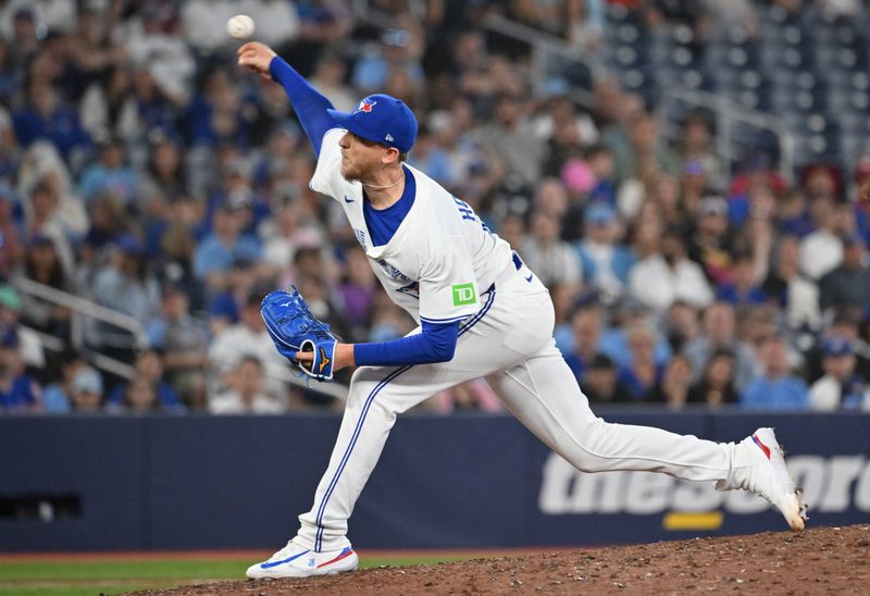 Jun 4, 2025; Toronto, Ontario, CAN;  Toronto Blue Jays relief pitcher Jeff Hoffman (30) delivers a pitch against the Philadelphia Phillies in the ninth inning at Rogers Centre. Mandatory Credit: Dan Hamilton-Imagn Images