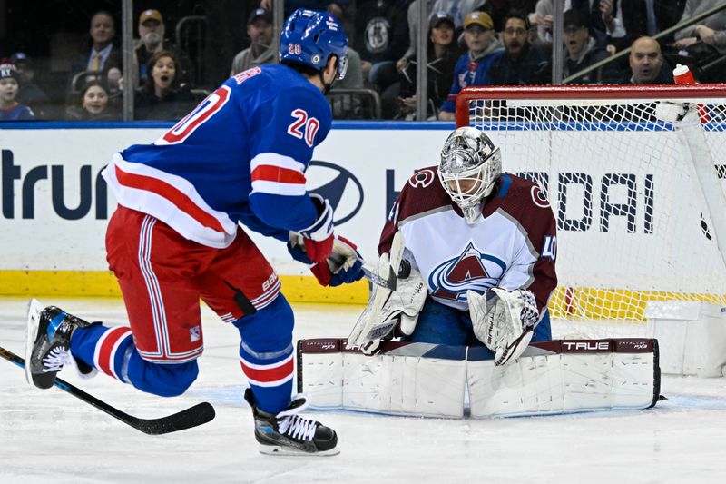 Feb 5, 2024; New York, New York, USA;  Colorado Avalanche goaltender Alexandar Georgiev (40) makes a save on New York Rangers left wing Chris Kreider (20) during the first period at Madison Square Garden. Mandatory Credit: Dennis Schneidler-USA TODAY Sports