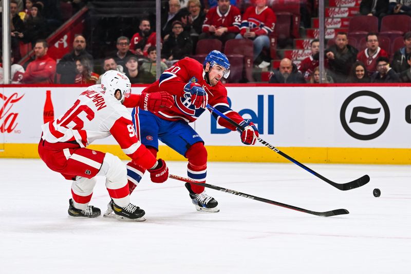 Dec 2, 2023; Montreal, Quebec, CAN; Montreal Canadiens left wing Tanner Pearson (70) shoots the puck as Detroit Red Wings defenseman Jake Walman (96) defends during the first period at Bell Centre. Mandatory Credit: David Kirouac-USA TODAY Sports