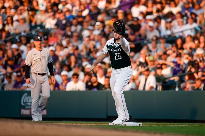 Jul 15, 2023; Denver, Colorado, USA; Colorado Rockies first baseman C.J. Cron (25) makes a catch at first for an out in the seventh inning against the New York Yankees at Coors Field. Mandatory Credit: Isaiah J. Downing-USA TODAY Sports