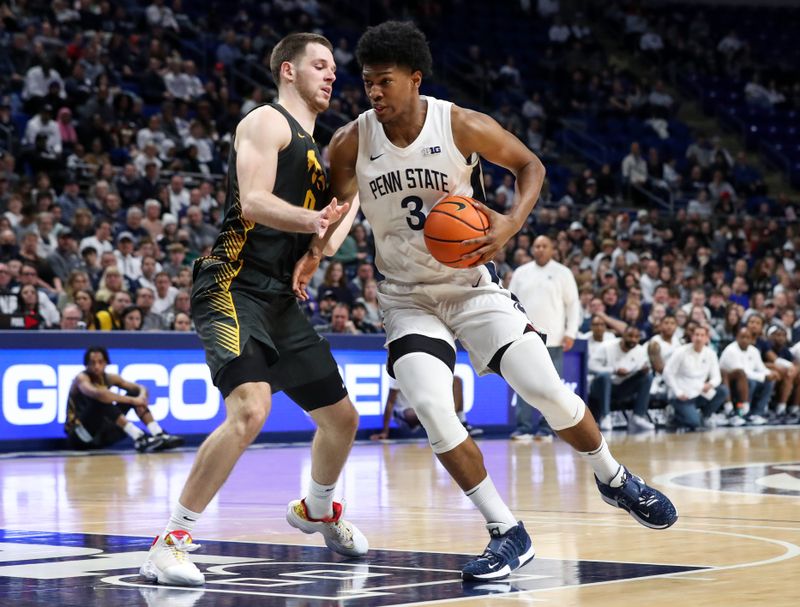 Jan 1, 2023; University Park, Pennsylvania, USA; Penn State Nittany Lions forward Kebba Njie (3) dribbles the ball around Iowa Hawkeyes forward Filip Rebraca (0) during the first half at Bryce Jordan Center. Penn State defeated Iowa 83-79. Mandatory Credit: Matthew OHaren-USA TODAY Sports