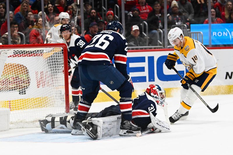 Dec 30, 2023; Washington, District of Columbia, USA; Washington Capitals goalie Hunter Shepard (31) makes a save on the shot by Nashville Predators center Gustav Nyquist (14) during the second period at Capital One Arena. Mandatory Credit: Brad Mills-USA TODAY Sports