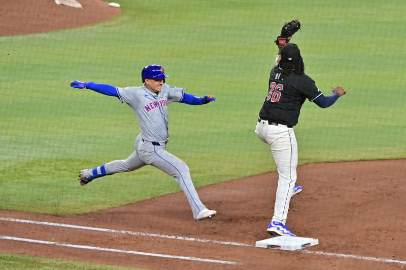 Aug 29, 2024; Phoenix, Arizona, USA;  New York Mets second base Jose Iglesias (11) is out against Arizona Diamondbacks first base Josh Bell (36) in the sixth inning at Chase Field. Mandatory Credit: Matt Kartozian-USA TODAY Sports