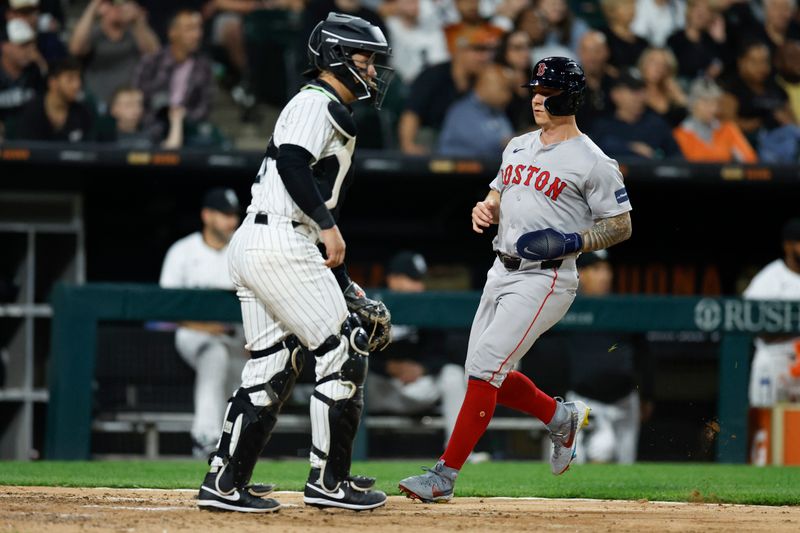 Jun 6, 2024; Chicago, Illinois, USA; Boston Red Sox outfielder Tyler O'Neill (17) scores against the Chicago White Sox during the sixth inning at Guaranteed Rate Field. Mandatory Credit: Kamil Krzaczynski-USA TODAY Sports