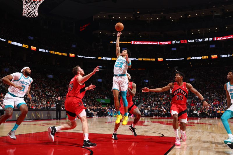 TORONTO, CANADA - MARCH 3: Tre Mann #23 of the Charlotte Hornets shoots the ball during the game against the Toronto Raptors on March 3, 2024 at the Scotiabank Arena in Toronto, Ontario, Canada.  NOTE TO USER: User expressly acknowledges and agrees that, by downloading and or using this Photograph, user is consenting to the terms and conditions of the Getty Images License Agreement.  Mandatory Copyright Notice: Copyright 2024 NBAE (Photo by Vaughn Ridley/NBAE via Getty Images)