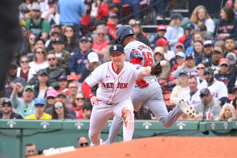 May 12, 2024; Boston, Massachusetts, USA;  Boston Red Sox first baseman Garrett Cooper (28) tags Washington Nationals center fielder Victor Robles (16) during the third inning at Fenway Park. Mandatory Credit: Eric Canha-USA TODAY Sports