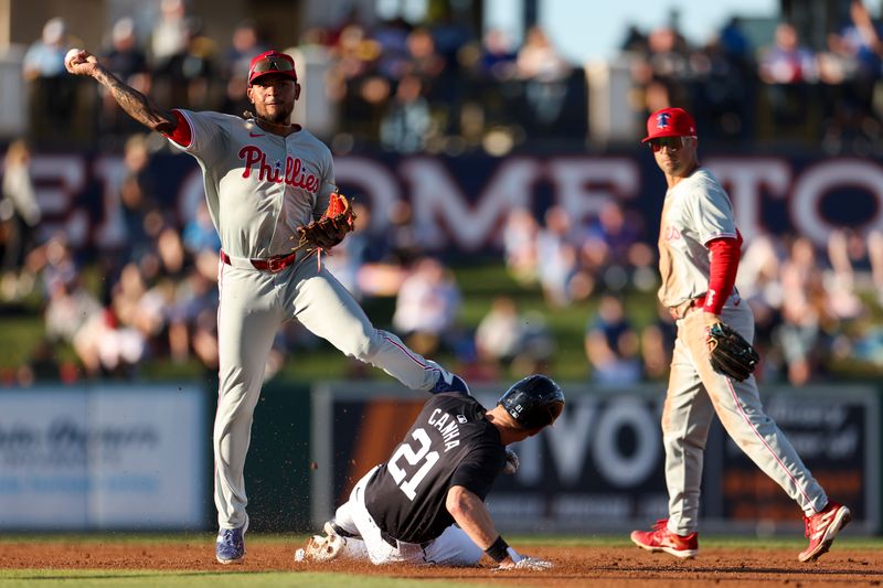 Mar 19, 2024; Lakeland, Florida, USA;  Philadelphia Phillies shortstop Edmundo Sosa (33) turns a double play against the Detroit Tigers in the second inning at Publix Field at Joker Marchant Stadium. Mandatory Credit: Nathan Ray Seebeck-USA TODAY Sports