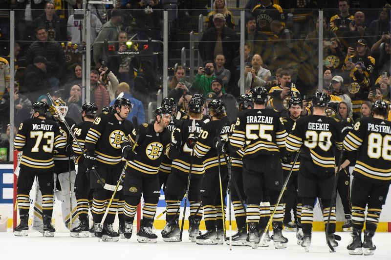 Mar 19, 2024; Boston, Massachusetts, USA;  The Boston Bruins celebrate their victory over the Ottawa Senators at TD Garden. Mandatory Credit: Bob DeChiara-USA TODAY Sports