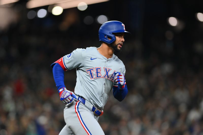 Sep 14, 2024; Seattle, Washington, USA; Texas Rangers center fielder Leody Taveras (3) runs the bases after hitting a 2-run home against the Seattle Mariners during the third inning at T-Mobile Park. Mandatory Credit: Steven Bisig-Imagn Images