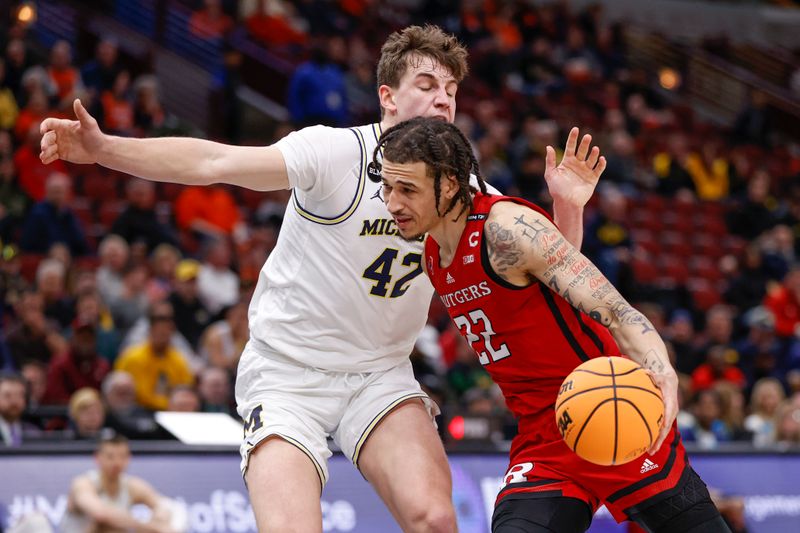 Mar 9, 2023; Chicago, IL, USA; Rutgers Scarlet Knights guard Caleb McConnell (22) drives to the basket against Michigan Wolverines forward Will Tschetter (42) during the first half at United Center. Mandatory Credit: Kamil Krzaczynski-USA TODAY Sports