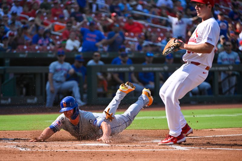 Aug 5, 2024; St. Louis, Missouri, USA;  New York Mets first baseman Pete Alonso (20) slides safely past St. Louis Cardinals starting pitcher Andre Pallante (53) and scores on a wild pitch during the second inning  at Busch Stadium. Mandatory Credit: Jeff Curry-USA TODAY Sports