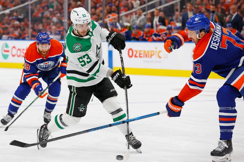 May 27, 2024; Edmonton, Alberta, CAN;   Dallas Stars forward Wyatt Johnson (53) tries to get a shot away in front of Edmonton Oilers defensemen Vincent Desharnais (73) during the second period in game three of the Western Conference Final of the 2024 Stanley Cup Playoffs at Rogers Place. Mandatory Credit: Perry Nelson-USA TODAY Sports
