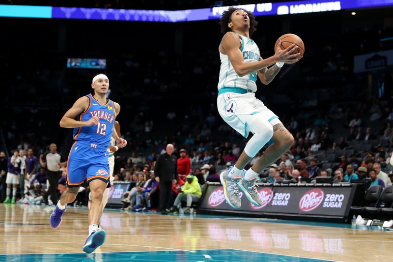 CHARLOTTE, NC - OCTOBER 15: Nick Smith Jr. #8 of the Charlotte Hornets drives to the basket during the game against the Oklahoma City Thunder on October 15, 2023 at Spectrum Center in Charlotte, North Carolina. NOTE TO USER: User expressly acknowledges and agrees that, by downloading and or using this photograph, User is consenting to the terms and conditions of the Getty Images License Agreement.  Mandatory Copyright Notice:  Copyright 2023 NBAE (Photo by Brock Williams-Smith/NBAE via Getty Images)