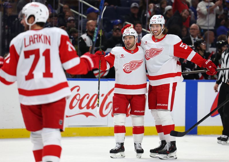 Oct 26, 2024; Buffalo, New York, USA;  Detroit Red Wings right wing Alex DeBrincat (93) celebrates his goal with teammates during the first period against the Buffalo Sabres at KeyBank Center. Mandatory Credit: Timothy T. Ludwig-Imagn Images