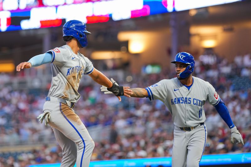 Aug 12, 2024; Minneapolis, Minnesota, USA; Kansas City Royals outfielder MJ Melendez (1) celebrates his run with third base Maikel Garcia (11) against the Minnesota Twins in the sixth inning at Target Field. Mandatory Credit: Brad Rempel-USA TODAY Sports