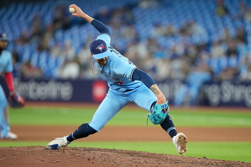 May 30, 2023; Toronto, Ontario, CAN; Toronto Blue Jays pitcher Adam Cimber (90) pitches to the Milwaukee Brewers during the eighth inning at Rogers Centre. Mandatory Credit: John E. Sokolowski-USA TODAY Sports