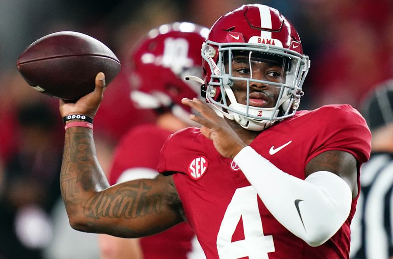 Nov 4, 2023; Tuscaloosa, Alabama, USA; Alabama Crimson Tide quarterback Jalen Milroe (4) passing during warmups before their game against the LSU Tigers at Bryant-Denny Stadium. Mandatory Credit: John David Mercer-USA TODAY Sports