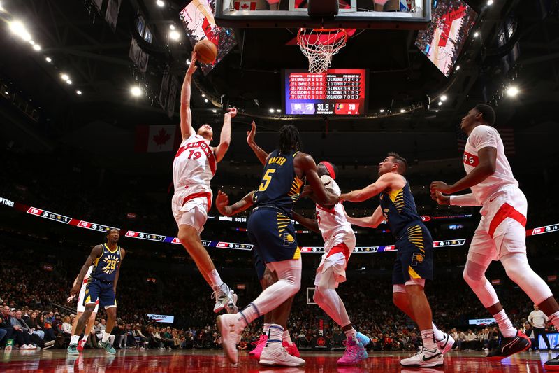 TORONTO, CANADA - NOVEMBER 18: Jakob Poeltl #19 of the Toronto Raptors shoots the ball during the game against the Indiana Pacers on November 18, 2024 at the Scotiabank Arena in Toronto, Ontario, Canada.  NOTE TO USER: User expressly acknowledges and agrees that, by downloading and or using this Photograph, user is consenting to the terms and conditions of the Getty Images License Agreement.  Mandatory Copyright Notice: Copyright 2024 NBAE (Photo by Vaughn Ridley/NBAE via Getty Images)