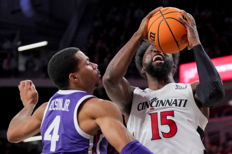 Jan 16, 2024; Cincinnati, Ohio, USA;  Cincinnati Bearcats forward John Newman III (15) drives to the basket against TCU Horned Frogs guard Jameer Nelson Jr. (4) in the first half at Fifth Third Arena. Mandatory Credit: Aaron Doster-USA TODAY Sports