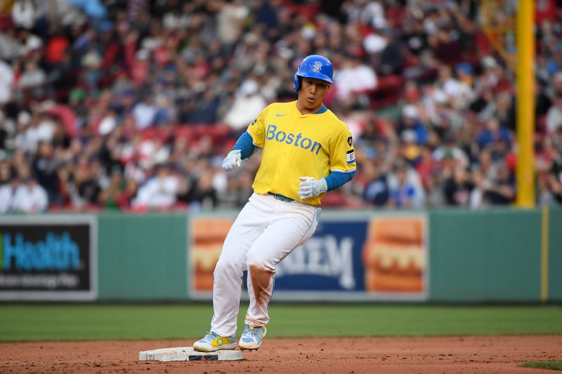 Apr 27, 2024; Boston, Massachusetts, USA;  Boston Red Sox designated hitter Masataka Yoshida (7) stops at second base after hitting an RBI double during the eighth inning against the Chicago Cubs at Fenway Park. Mandatory Credit: Bob DeChiara-USA TODAY Sports