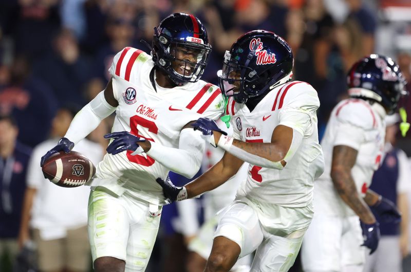 Oct 21, 2023; Auburn, Alabama, USA;  Mississippi Rebels cornerback Zamari Walton (6) celebrates with cornerback Deantre Prince (7) after intercepting a pass in the end zone against the Auburn Tigers during the fourth quarter at Jordan-Hare Stadium. Mandatory Credit: John Reed-USA TODAY Sports