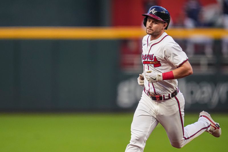Sep 4, 2024; Cumberland, Georgia, USA; Atlanta Braves outfielder Jarred Kelenic (24) runs the bases after hitting a three run home run against the Colorado Rockies during the first inning at Truist Park. Mandatory Credit: Dale Zanine-Imagn Images