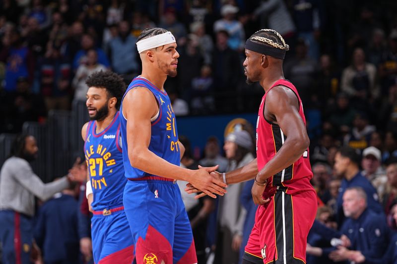 DENVER, CO - NOVEMBER 8: Michael Porter Jr. #1 of the Denver Nuggets greets Jimmy Butler #22 of the Miami Heat after the game on November 8, 2024 at Ball Arena in Denver, Colorado. NOTE TO USER: User expressly acknowledges and agrees that, by downloading and/or using this Photograph, user is consenting to the terms and conditions of the Getty Images License Agreement. Mandatory Copyright Notice: Copyright 2024 NBAE (Photo by Bart Young/NBAE via Getty Images)