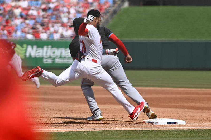 Apr 7, 2024; St. Louis, Missouri, USA; St. Louis Cardinals outfielder Victor Scott II (11) is out at first during the third inning at Busch Stadium. Mandatory Credit: Jeff Le-USA TODAY Sports