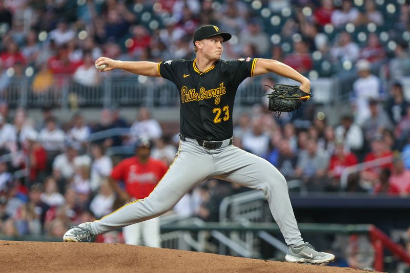 Sep 26, 2025; Cumberland, Georgia, USA; Pittsburgh Pirates pitcher Mitch Keller (23) pitches the ball against the Atlanta Braves during the first inning at Truist Park. Mandatory Credit: Jordan Godfree-Imagn Images