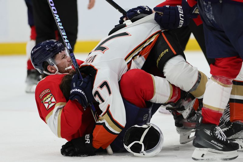 Jan 15, 2024; Sunrise, Florida, USA; Florida Panthers left wing Matthew Tkachuk (19) and Anaheim Ducks right wing Frank Vatrano (77) fight during the third period at Amerant Bank Arena. Mandatory Credit: Sam Navarro-USA TODAY Sports