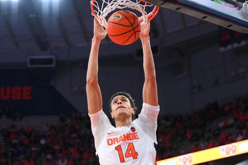 Jan 14, 2023; Syracuse, New York, USA; Syracuse Orange center Jesse Edwards (14) dunks the ball against the Notre Dame Fighting Irish during the first half at the JMA Wireless Dome. Mandatory Credit: Rich Barnes-USA TODAY Sports