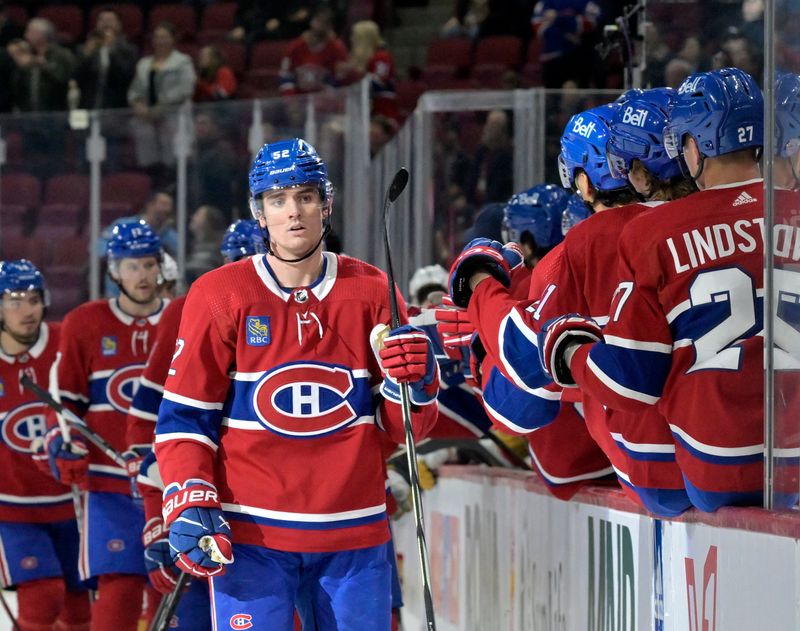 Nov 16, 2023; Montreal, Quebec, CAN; Montreal Canadiens defenseman Justin Barron (52) celebrates with teammates after scoring a goal against the Vegas Golden Knights during the third period at the Bell Centre. Mandatory Credit: Eric Bolte-USA TODAY Sports