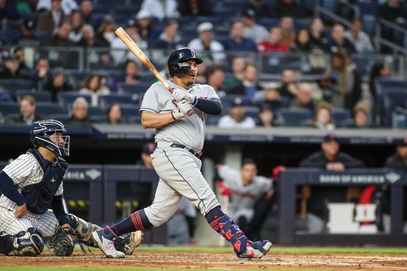 May 2, 2023; Bronx, New York, USA;  Cleveland Guardians designated hitter Josh Naylor (22) hits a RBI double in the third inning against the New York Yankees at Yankee Stadium. Mandatory Credit: Wendell Cruz-USA TODAY Sports