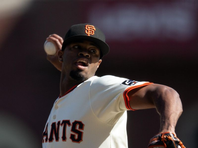 Sep 27, 2025; San Francisco, California, USA; San Francisco Giants pitcher Joel Peguero (63) delivers a pitch against the Colorado Rockies during the seventh inning at Oracle Park. Mandatory Credit: D. Ross Cameron-Imagn Images